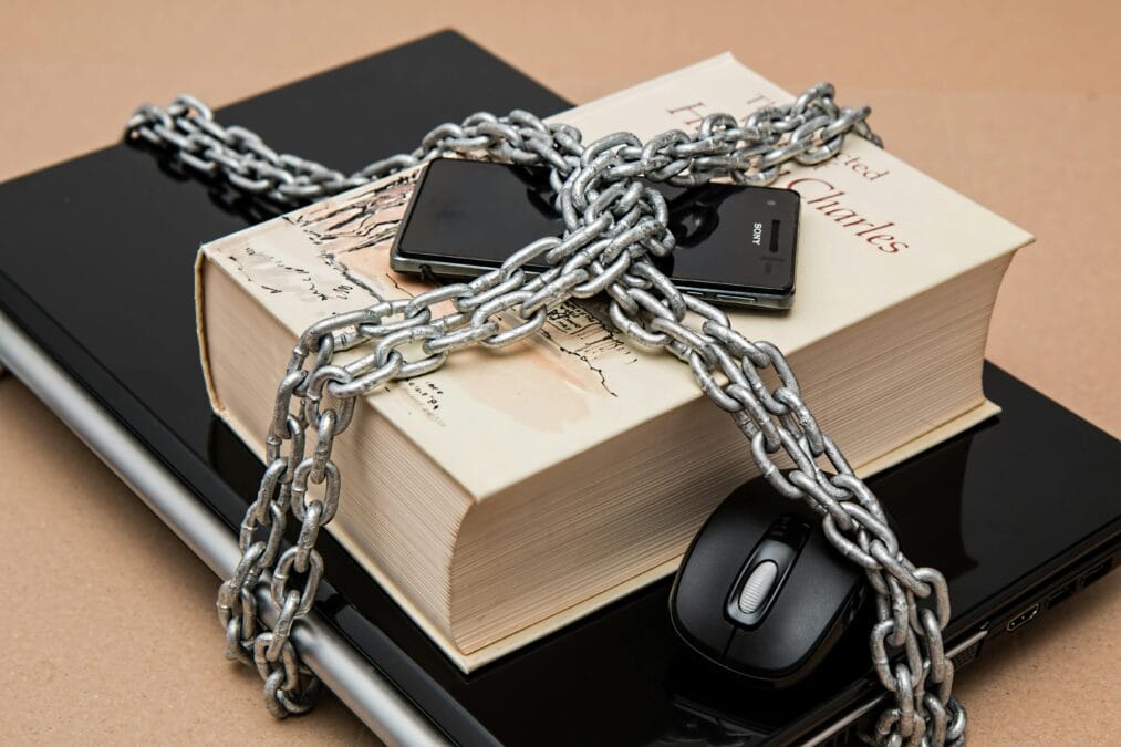 phone and books locked with chain